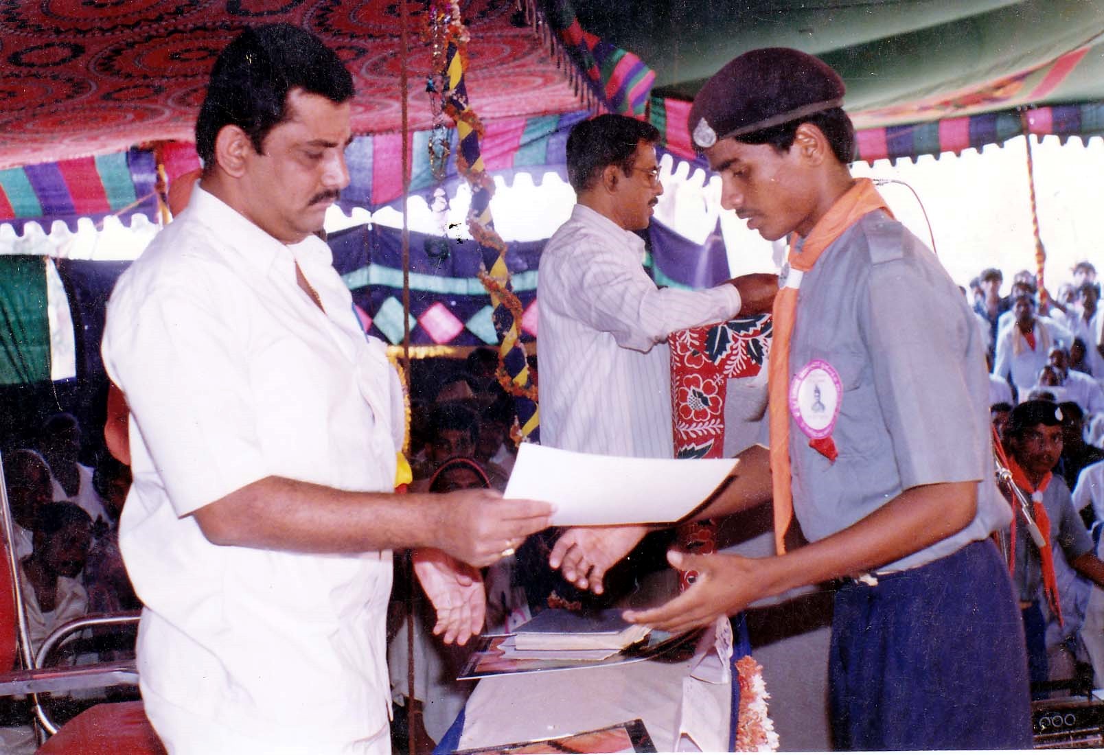 Student receiving recognition at an educational gathering