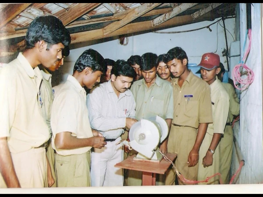 Students learning technical skills in a workshop